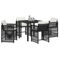 Ensemble de jardin 5 pièces avec des coussins noirs en poly rattan. 