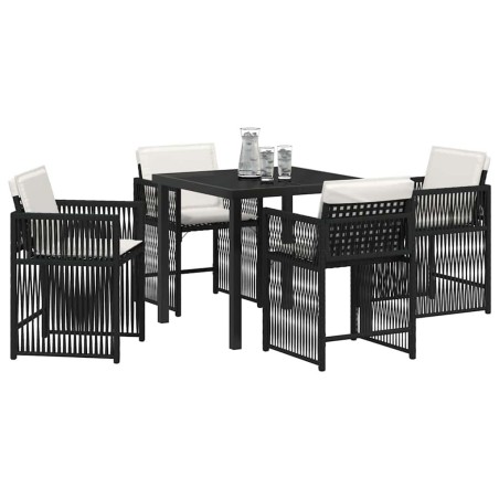 Ensemble de jardin 5 pièces avec des coussins noirs en poly rattan. 
